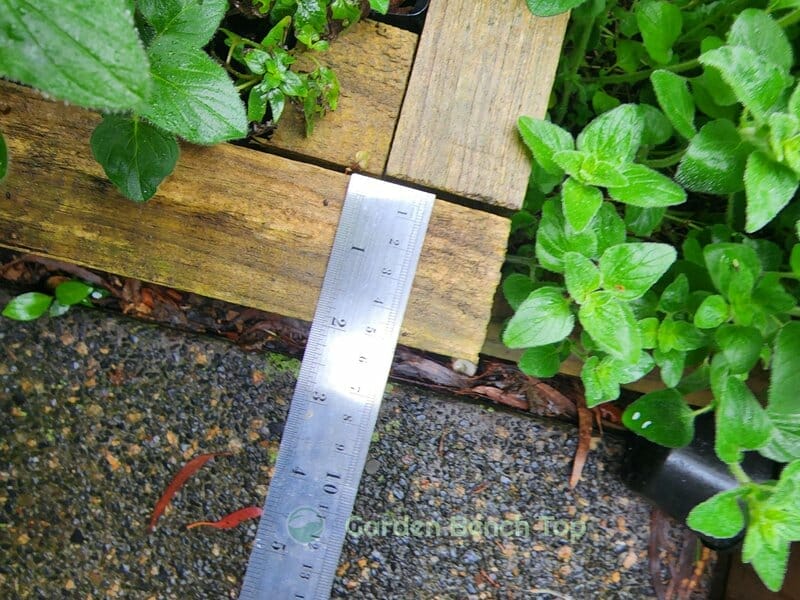 measuring wood for raised garden bed